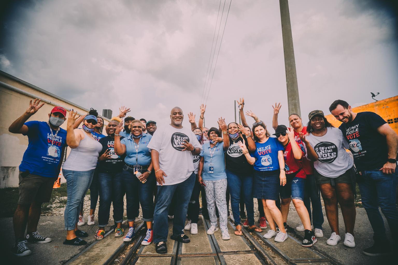 Desmond Meade and the team at the railroad tracks
